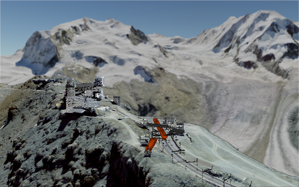 Das Bild zeigt die Gornergrat-Sternwarte mit dem Bahnhof Gornergrat und dem Monte Rosa Massiv im Hintergrund.