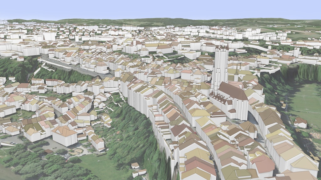L'immagine mostra i modelli 3D degli edifici della città di Friborgo integrati in un modello 3D texturizzato con un'immagine aerea.